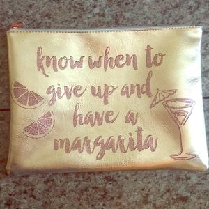 Metallic gold cosmetics bag.